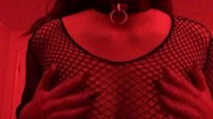 Nubile In Fishnets Playing With Her Huge Breasts