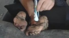 Spy In Fishnet Pantyhose Soles Tickled
